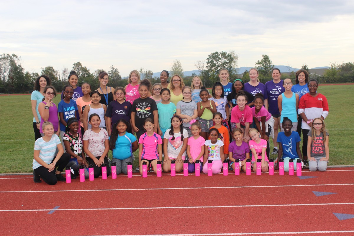 Group photo of girls on the track.