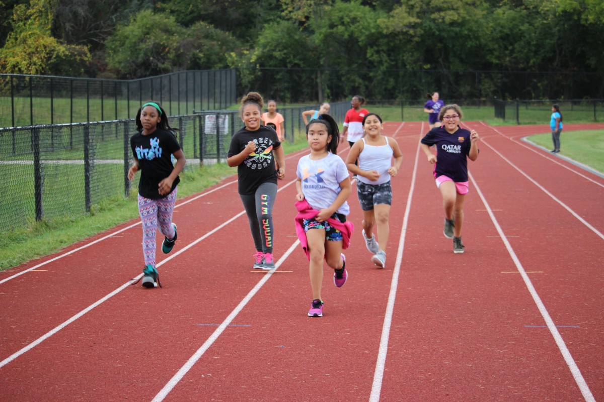 Girls running on track 1