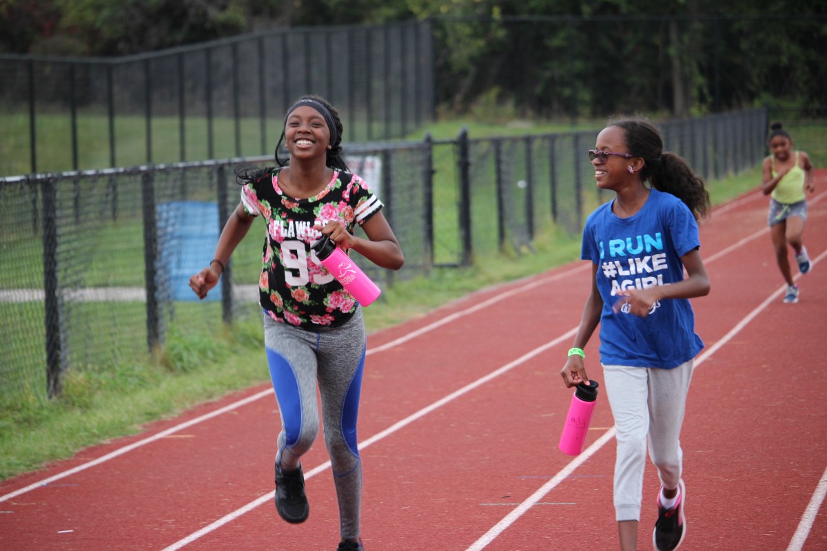 Girls running on track 5