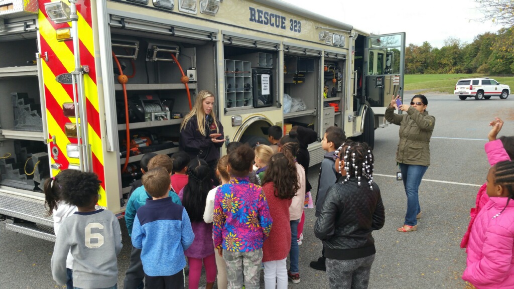 Students looking inside firetruck