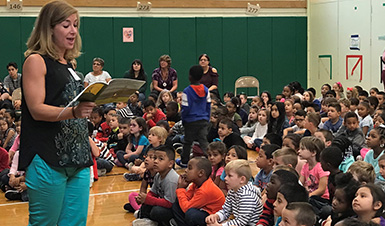 Author talking to group of students.