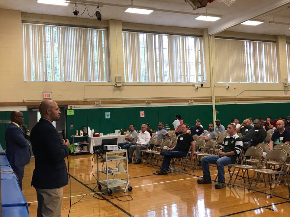 Dr. Padilla talks to the dads during the event.