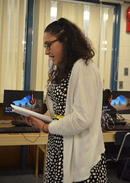 A female student discussing the lab.