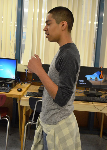 A male student discussing the lab.