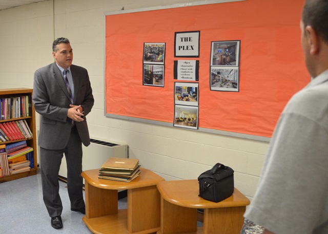 Principal Lopez discussing the lab.