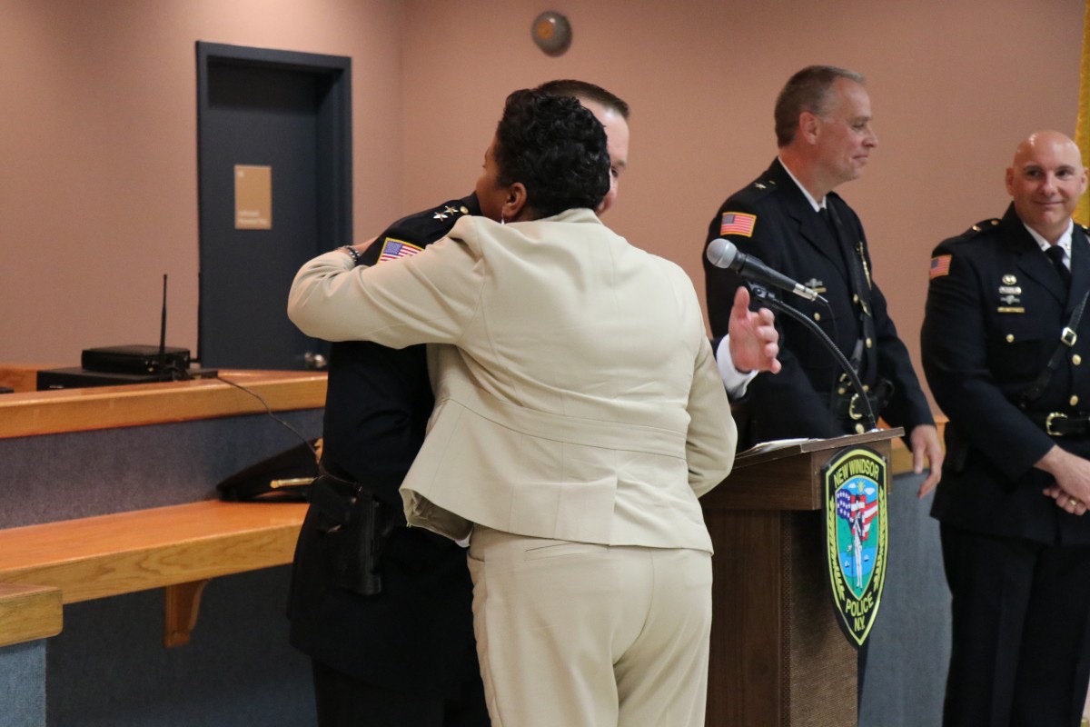 Mrs. Briscoe-Perez accepts the award from Chief Robert Doss.