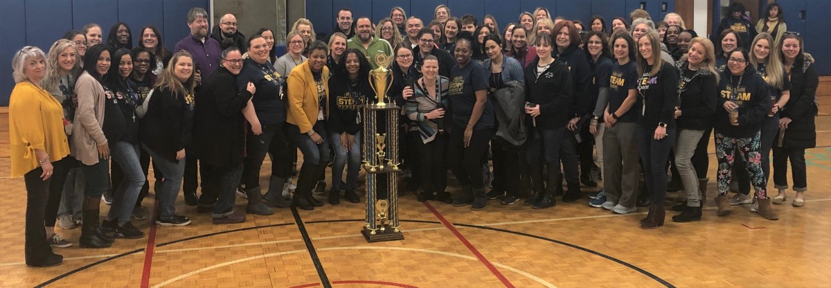 Vails Gate Steam Academy pose for a photo with the Attendance Trophy.