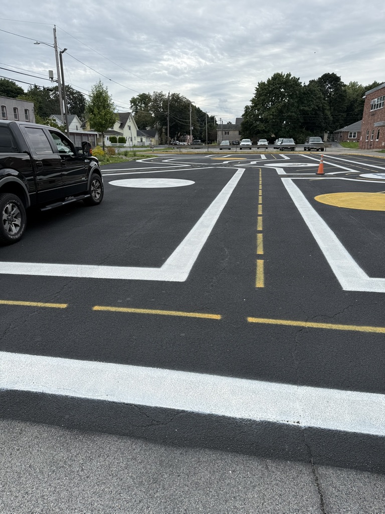 A newly paved bike garden with painted riding lanes and traffic markings.